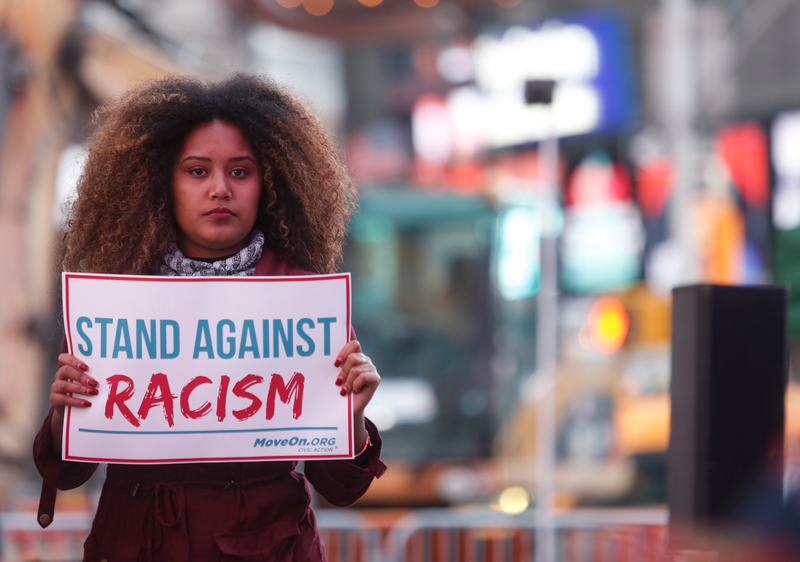 Members of MoveOn.org Political Action stand outside the studios of Good Morning America in New York City on March 16, 2016, to broadcast messages of love, dignity and equality and stand up against the hate, racism and incitement of violence that the group says has become a hallmark of Donald Trump’s presidential campaign.Thos Robinson/Getty Images for MoveOn.org Political Action